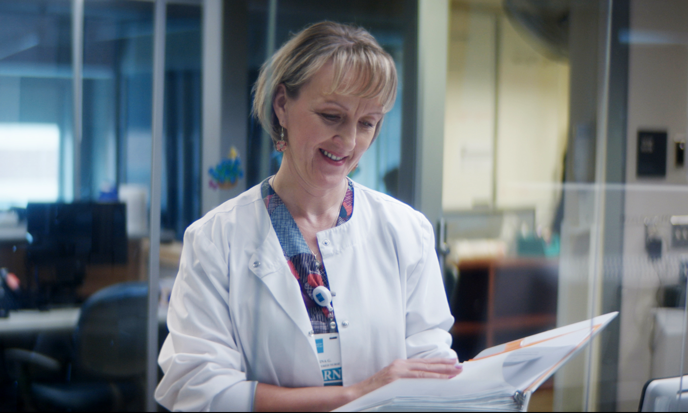 Doctor looking at textbook